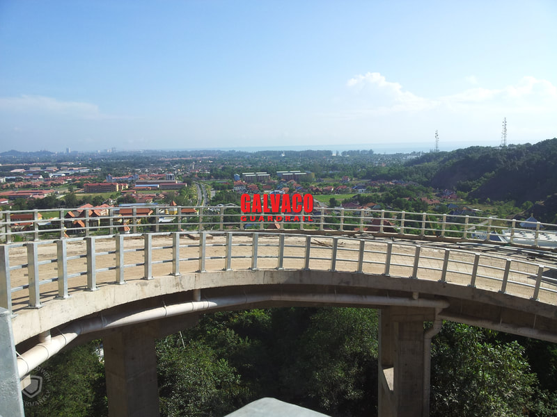 Galvanized Bridge Handrail on a curve bridge helps guide cars and keep them safe from veering of the bridge