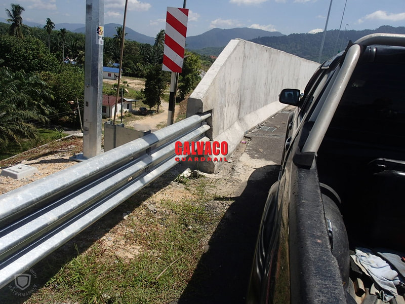 Thrie Beam Guardrail with a bridge connector to ensure highway road safety between roads and bridges